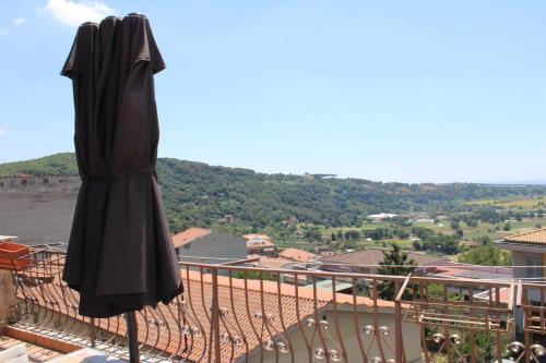 an umbrella sitting on top of a balcony at Center Ariccia in Ariccia