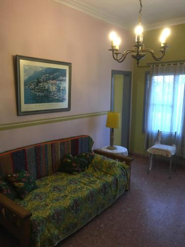 a living room with a couch and a chair at TERRAZAS DEL SUR in Ezpeleta