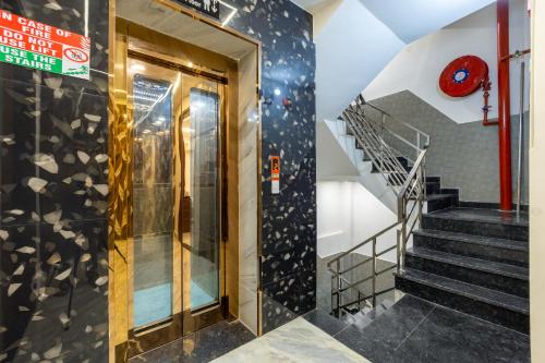a staircase with a glass door in a building at Hotel U N Star - 5 Minutes Walking Distance from New Delhi Railway Station and Metro Station in New Delhi