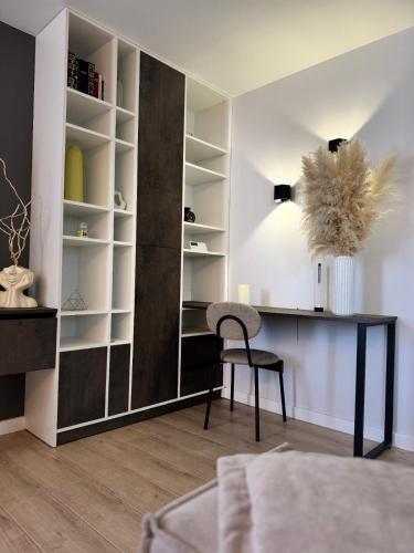 a living room with a desk and a chair at Premium apartment in Ternopilʼ