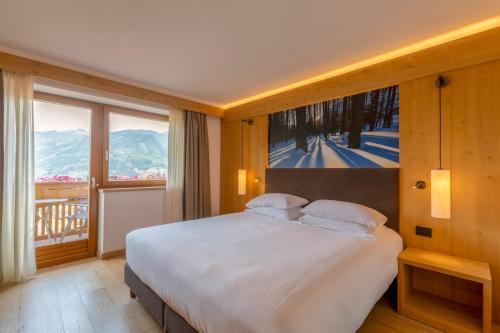 Postel nebo postele na pokoji v ubytování Hotel Lagorai Resort & Spa