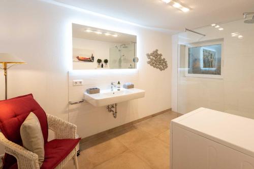 a bathroom with a sink and a mirror at Haus Gorch Fock Strasse in Westerland