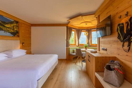 Postel nebo postele na pokoji v ubytování Hotel Lagorai Resort & Spa