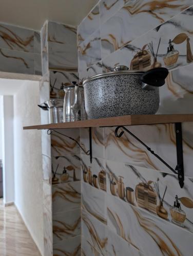 a bathroom with a sink on a wall at Beach House - Tamraght, Aourir in Aourir