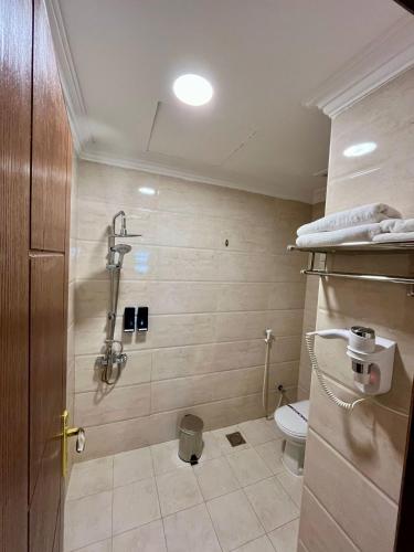 a bathroom with a shower and a toilet at لافانتا للشقق المخدومه - LAVANTA Hotel in Al Khobar