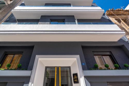 a facade of a building with plants on it at Athens Meli in Athens