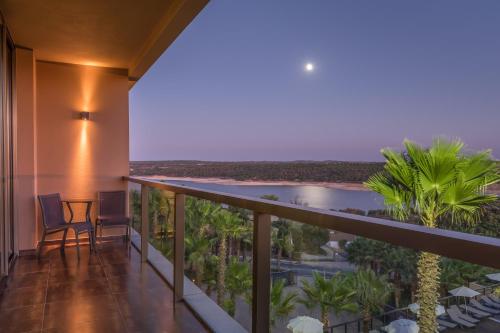 a balcony with a view of the ocean at AP Lago Montargil - Conference & SPA in Montargil