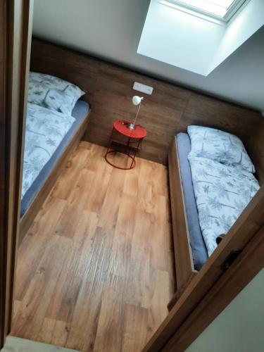 an overhead view of a room with two beds and a table at Apartmány Moravia in Milovice