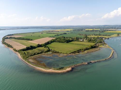 an aerial view of an island in the water at Canute Cottages - Cullimers Cottage in Chidham