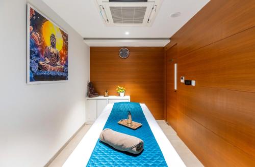 a room with a bed with a scale on it at The Paradise Bliss - A Luxury Hotel & Spa in Udaipur in Udaipur