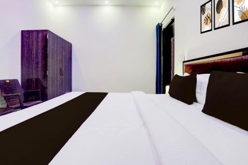 Ένα ή περισσότερα κρεβάτια σε δωμάτιο στο Hotel O Gvk Grand
