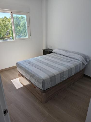 Ένα ή περισσότερα κρεβάτια σε δωμάτιο στο Apartamento Luxury la Ballena