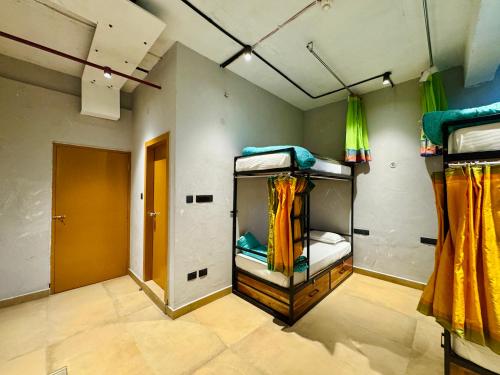 a room with three bunk beds in it at Local Lok in Varanasi
