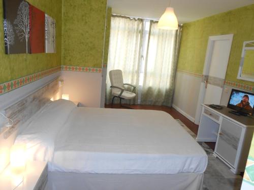 Ένα ή περισσότερα κρεβάτια σε δωμάτιο στο Hotel Canton