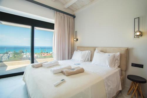 Ένα ή περισσότερα κρεβάτια σε δωμάτιο στο Sunrise Villas Collection