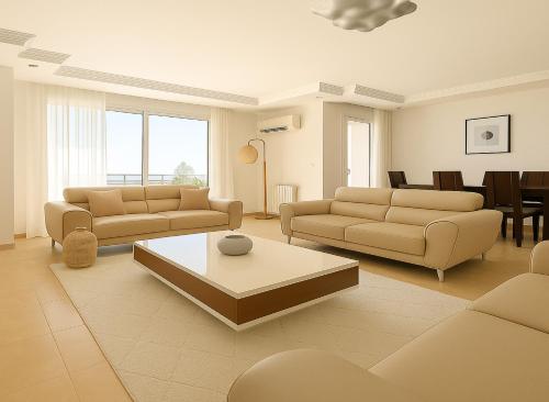 a living room with two couches and a table at Appartement Charmant à Hydra in Hydra