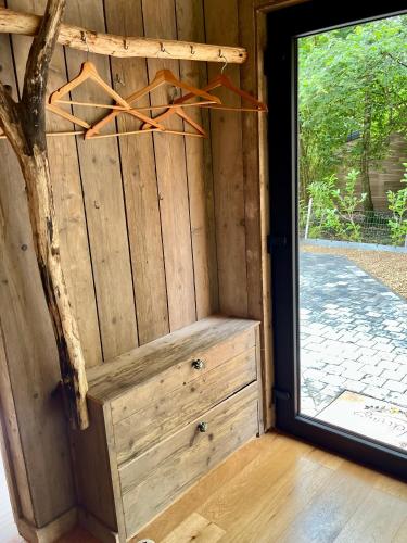 a wooden door with a drawer and a window at La noisette in Florennes