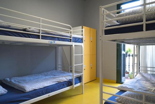 Posteľ alebo postele v izbe v ubytovaní Sleep Green - Certified Eco Youth Hostel