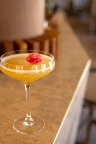 a drink in a martini glass on a counter at L'Hôtel & Spa du Castellet in Le Castellet