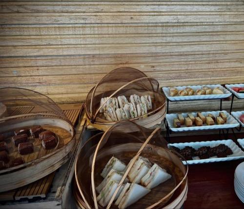a display of different types of pastries and desserts at Seaweed Village 2 in Pulau Sabangkat