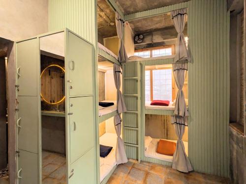 a room with two bunk beds in it at Bunkyard in Udaipur
