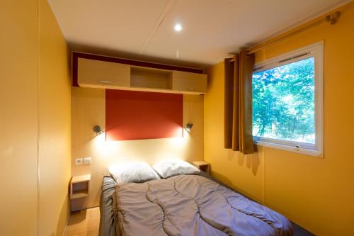 Postel nebo postele na pokoji v ubytování Mobilhome 4 personnes climatisé