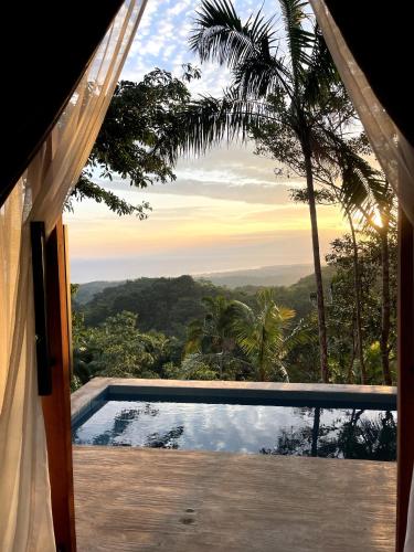 a view from the window of a house with a swimming pool at Drako Villas in Siquijor