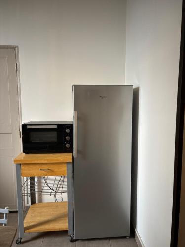 Kuchyň nebo kuchyňský kout v ubytování Appartement au cœur des arènes