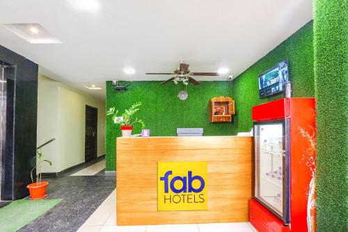 a fast food restaurant with aida hooters sign on the wall at FabHotel Galaxy Suites I in Hyderabad