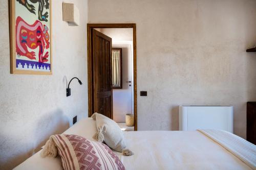 Katil atau katil-katil dalam bilik di Masseria Guadalupe