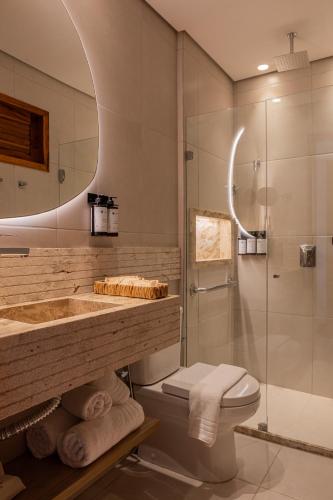 a bathroom with a sink toilet and a shower at Saluz Boutique Hotel in Jericoacoara