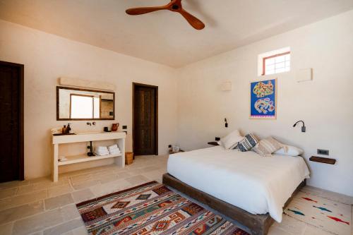 Katil atau katil-katil dalam bilik di Masseria Guadalupe