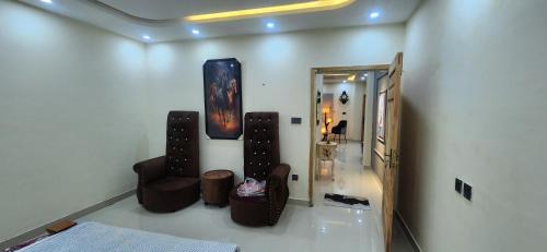 a room with a mirror and a room with furniture at Whispering heights in Murree