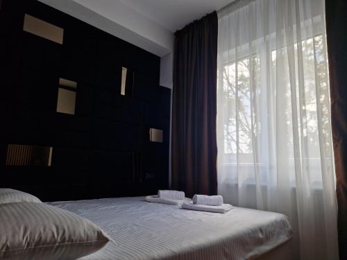 Ένα ή περισσότερα κρεβάτια σε δωμάτιο στο Mamaia Studio
