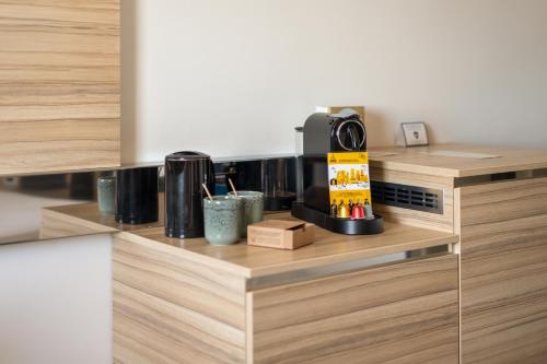 a coffee maker on a counter in a kitchen at Novotel Bordeaux Centre Ville in Bordeaux