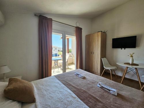 Una cama o camas en una habitación de Jasmin apartmani