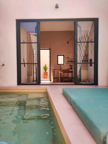 a house with a swimming pool and a living room at Casa Micocci di Casa Camilla Journey in Depressa