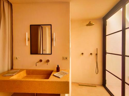 a bathroom with a sink and a mirror at Casa Micocci di Casa Camilla Journey in Depressa