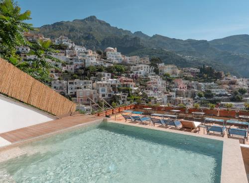 a swimming pool with a view of a city at Hotel Posa Posa in Positano