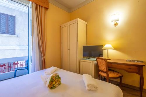 Ένα ή περισσότερα κρεβάτια σε δωμάτιο στο Hotel Pallanza by LVG Hotel Collection