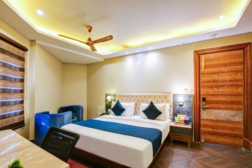 a hotel room with a bed and a table at The IVY Grand Hotel - 5 Minutes from Connaught Place and New Delhi Railway Station With Free Secured Parking in New Delhi