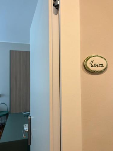 a refrigerator with a sign on the side of it at Il Giardinetto - Guest Room Policlinico in Messina