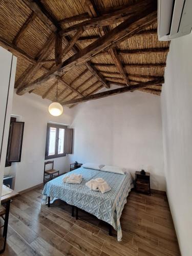 Postel nebo postele na pokoji v ubytování Dommu Amsicora Piano 2