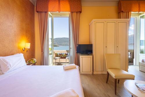 Ένα ή περισσότερα κρεβάτια σε δωμάτιο στο Hotel Pallanza by LVG Hotel Collection
