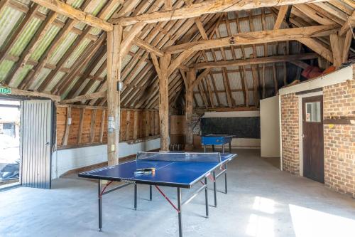 a room with a ping pong table in it at Canute Cottages - Cullimers Cottage in Chidham
