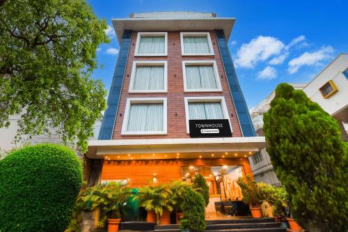 a building with a sign on the front of it at Super Townhouse Near Marine Drive in Puri