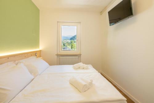 Katil atau katil-katil dalam bilik di Comune Rustico Sport Hotel