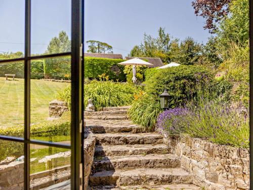a view out a window of a stone stairway at 7 Bed in Waterhouses 81529 in Waterhouses