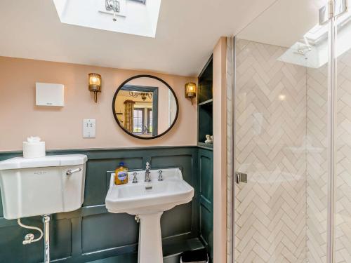 a bathroom with a sink and a mirror and a shower at 7 Bed in Waterhouses 81529 in Waterhouses