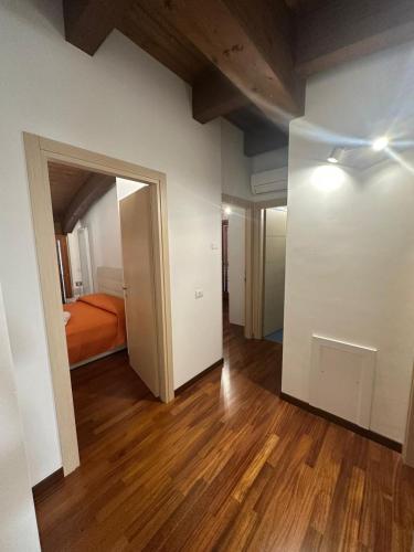 an empty room with a bed and an open door at Attico vista mare con Jacuzzi - CASA LUXURY DIAMANTE in Ortona